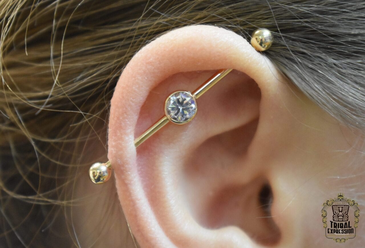 Tribal Made 14g 14k Yellow Gold Industrial Bar with a floating bezel set CZ