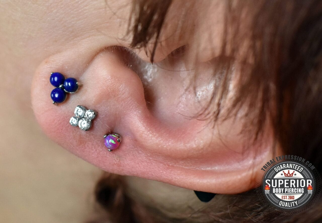 Triple lobe piercings with 14g titanium threaded ends from Anatometal and Industrial Strength