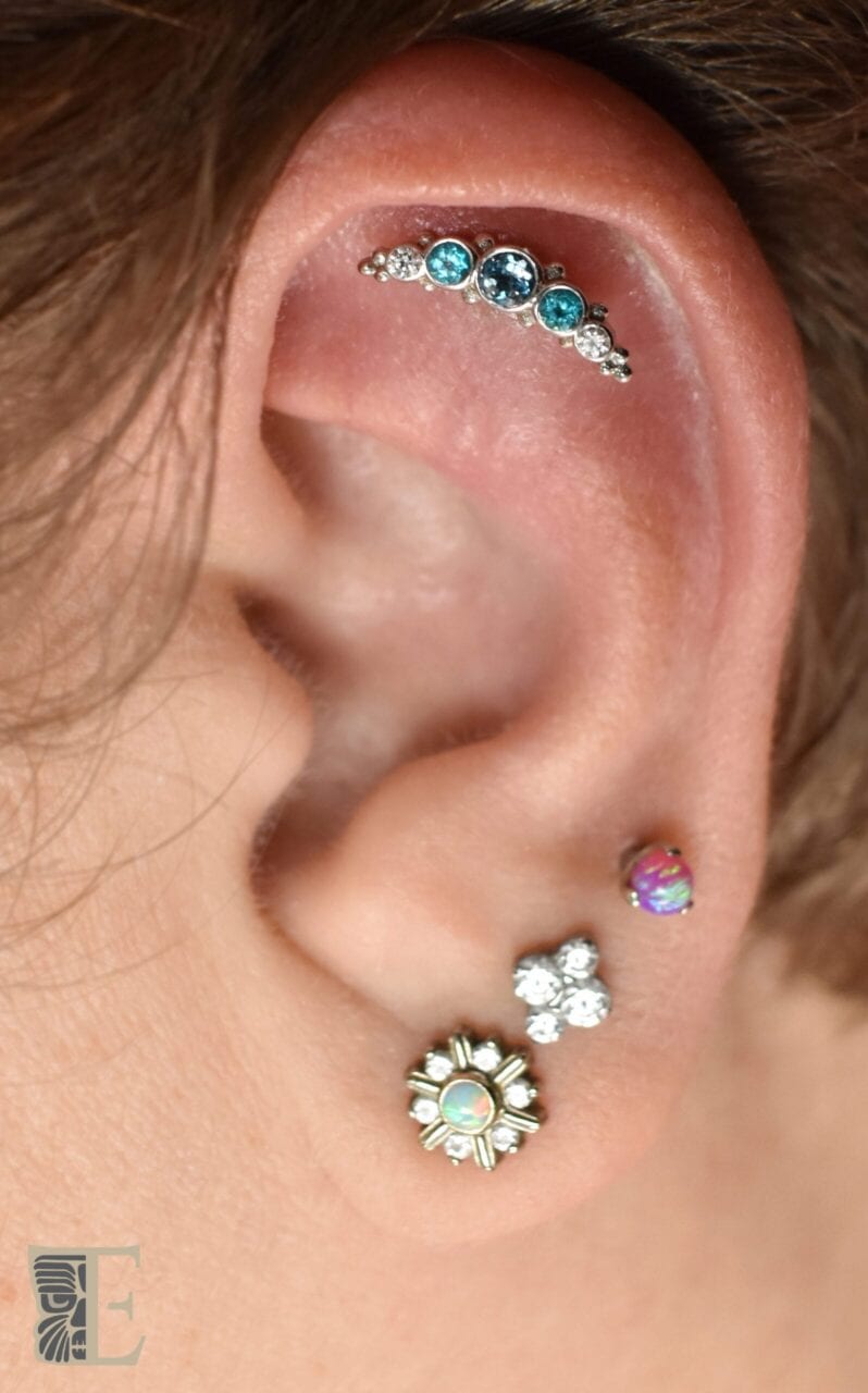 Triple lobe and flat piercings with a 14k white gold BVLA cluster, a 14k white gold threadless Maya end from NeoMetaland titanium threaded ends from Anatometal and Industrial Strength