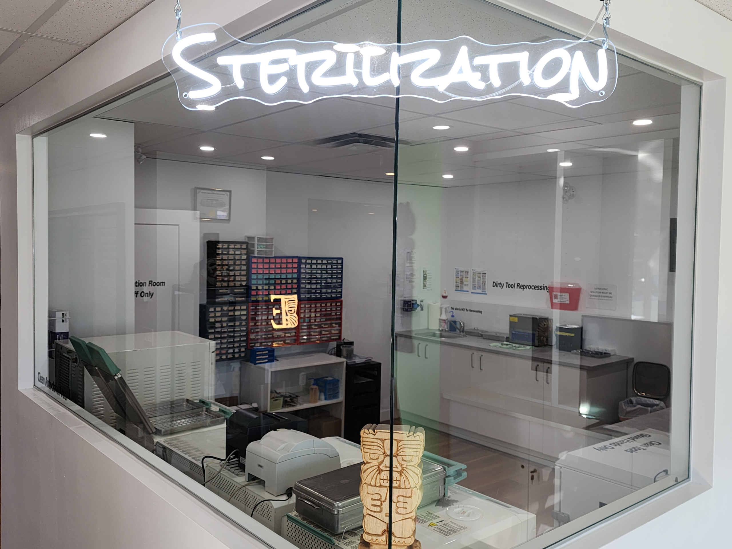 Tribal Expression sterilization room in Calgary where clients can see instruments and jewelry being sterilized